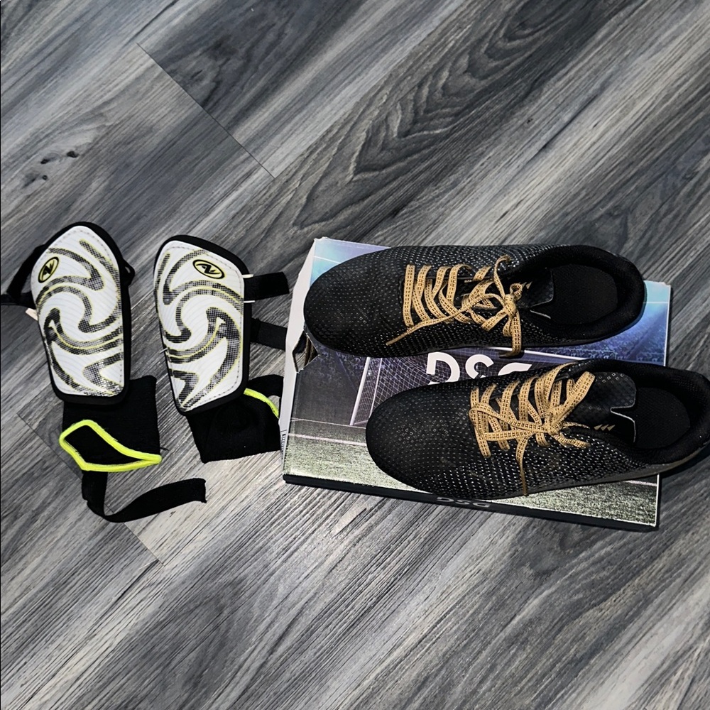 Black and Gold Soccer Cleats with Shin Guards